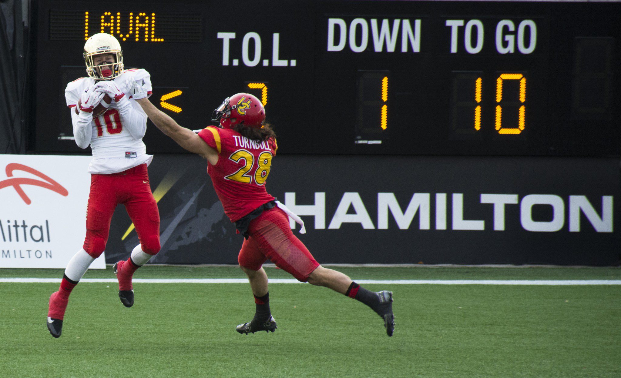 Calgary defender reaching for Laval player