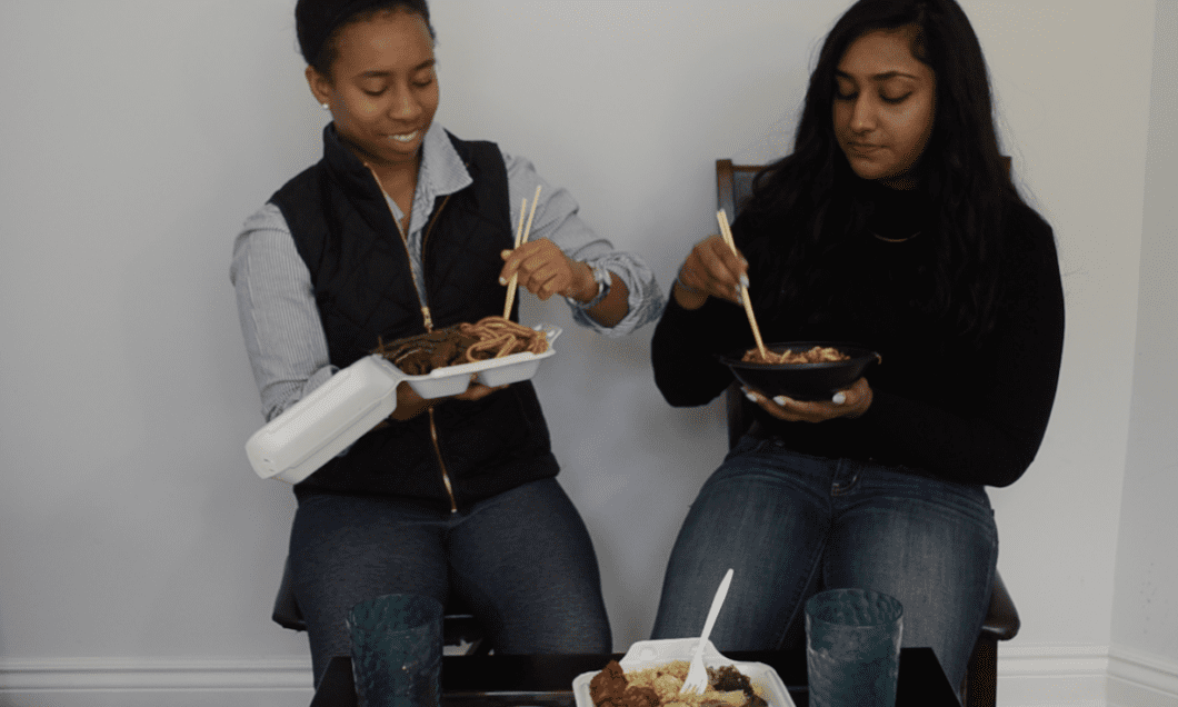 Krystal Reynolds and Melisha Ratnarajah eating