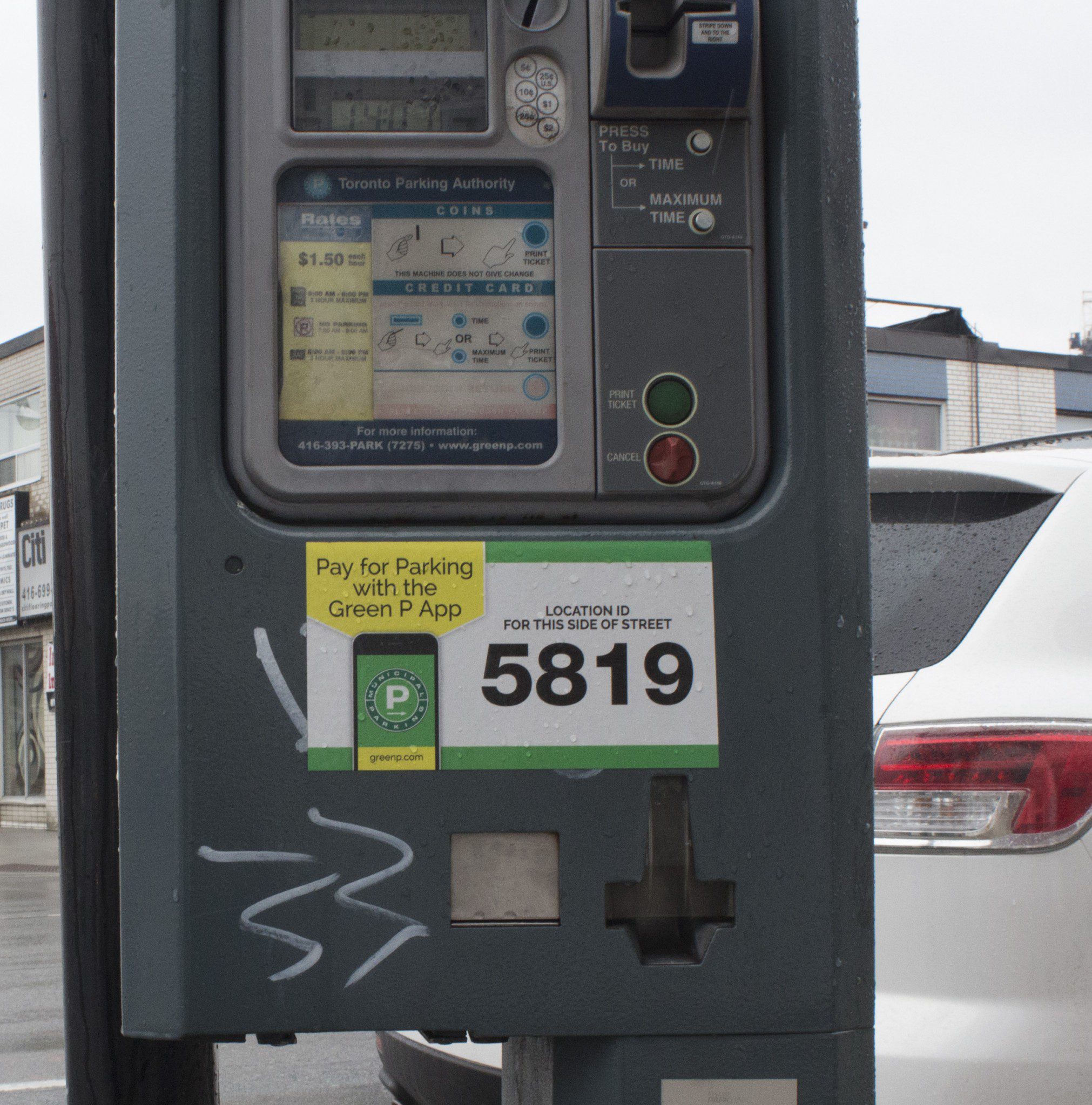sticker covers graffiti on parking meter