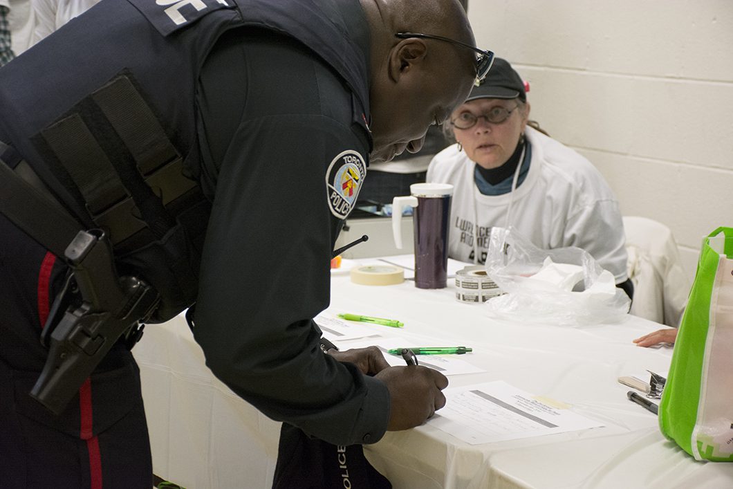 police officer signing paper