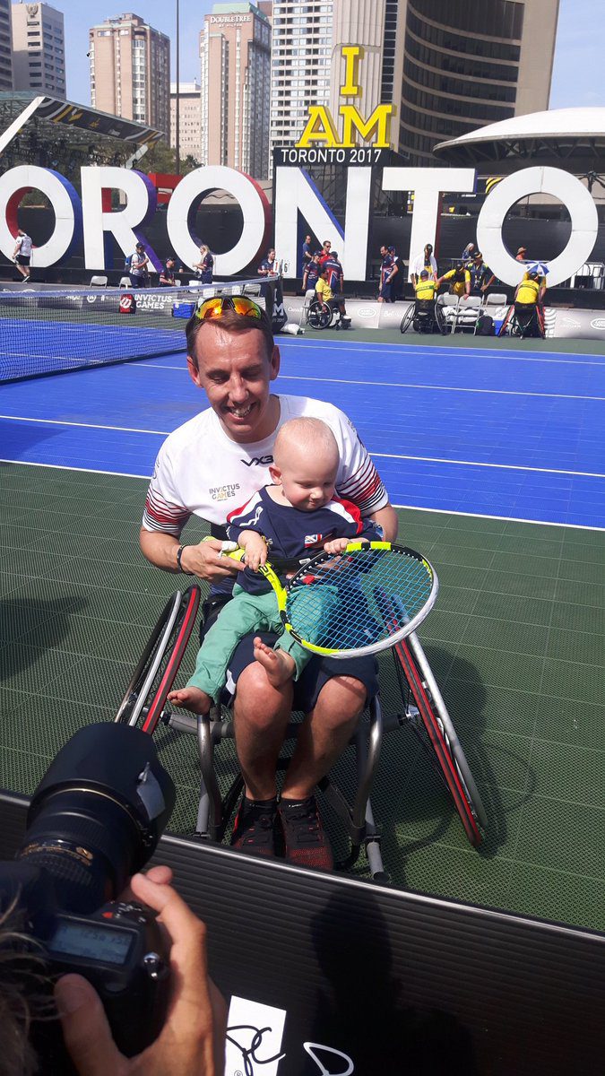 Krol and his son celebrate a gold medal for the United Kingdom on Monday evening at the Invictus Games.