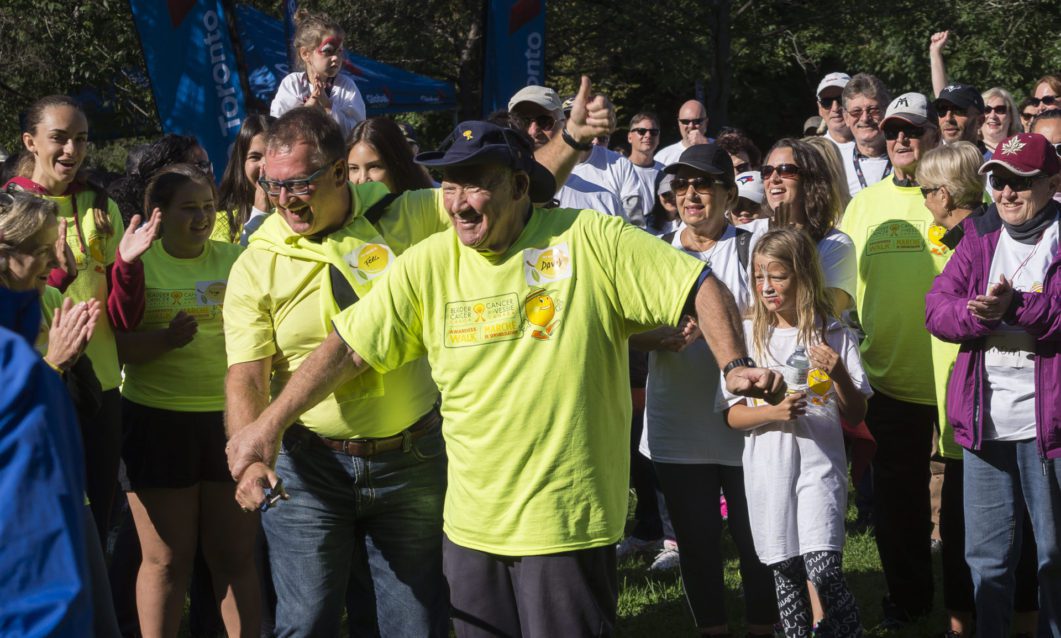Bladder Cancer Canada co-founder David Guttman and board chair Ferg Devins cut a ribbon before hundreds of participants commence the ninth annual walk for bladder cancer awareness.