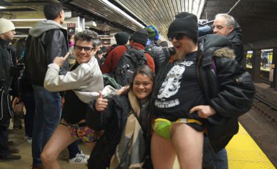 Pantsless participants posing for the camera.