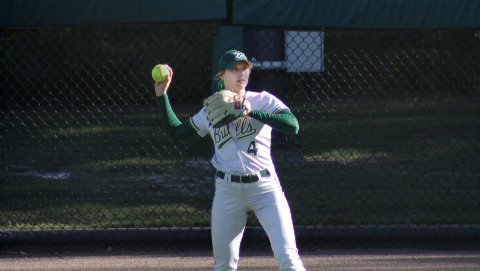 AnaMarie Bruni throws a ball from centre field in an afternoon game.