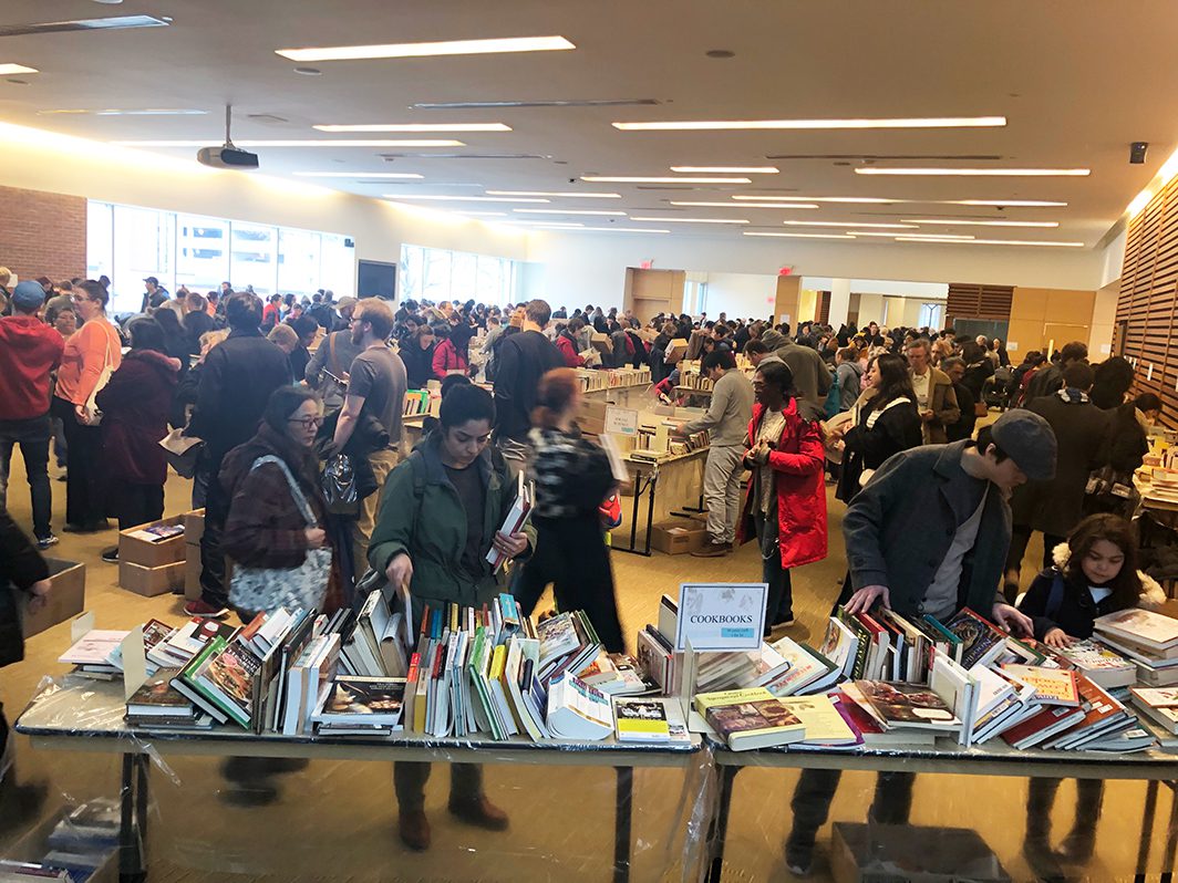 People sorting through used books