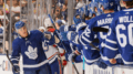 Toronto Maple Leafs winger Trevor Moore celebrates a goal with his teammates.