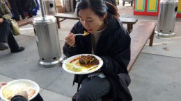 Woman eats a vegan cabbage roll