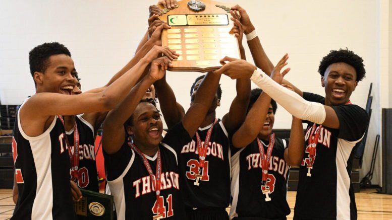 The David & Mary Thomson Titans celebrating their third-straight TDSSAA Senior Tier One Boys Basketball East Region title.