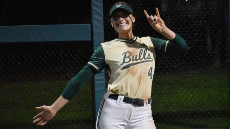 AnaMarie Bruni of USF softball poses with horns up