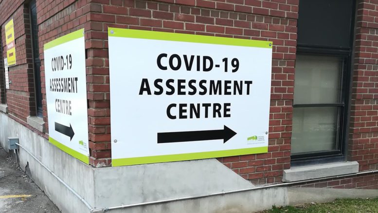 A sign for the COVID-19 Screening Centre At Michael Garron Hospital