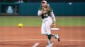 Georgina Corrick throwing ball towards the plate in game in Florida