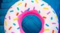 Inflatable pool donut with blue background