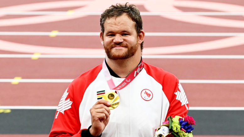 Greg Stewart, Canadian shot putter, with his gold medal at Tokyo 2020