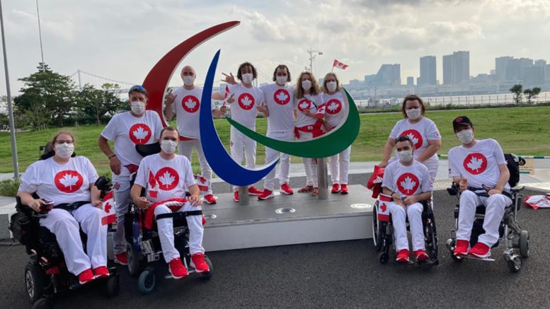 Canada's boccia team gets together for a picture in Tokyo at the Paralympics. Boccia athletes from left to right in the front row: Alison Levine, Iulian Ciobanu, Danik Allard and Marco Dispaltro.