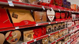 Rows of red and gold heart-shaped chocolate boxes.