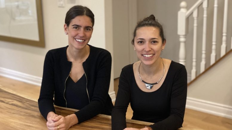Founder and CEO of Suppli, Megan Takeda-Tully sits at a table with co-founder Julianna Greco