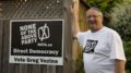 Greg Vezina, Leader of the None of The Above Party, stands with a NOTA Party sign on his front lawn in Missisauga on May 31.  (Boyan Demchuk/Toronto Observer)
