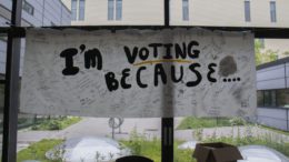 A banner at the University of Toronto Scarborough is filled with signatures and reasons for voting.