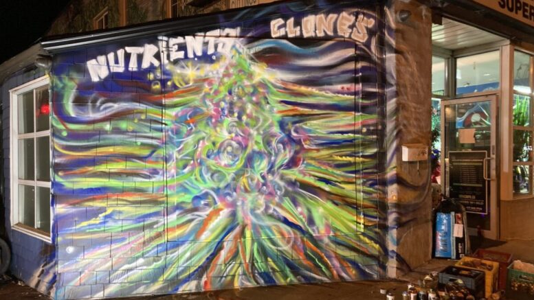 A multicolour mural titled "Nutrients Clones" is displayed at the corner of Bastedo and Danforth Avenues as part of Nuit Blanche 2022