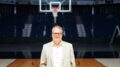 John Lashway, President of the Honey Badgers and EVP, Strategy and Communications for the CEBL, poses in front of a basketball hoop. Lashway carries decades of experience as a basketball executive in the NBA and now with the CEBL. (Photo courtesy of John Lashway/CEBL)  