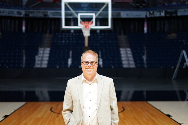 John Lashway, President of the Honey Badgers and EVP, Strategy and Communications for the CEBL, poses in front of a basketball hoop. Lashway carries decades of experience as a basketball executive in the NBA and now with the CEBL. (Photo courtesy of John Lashway/CEBL)  