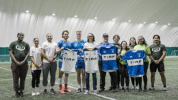 TIRF members with Toronto Arrows players holding the new 2023 team jerseys.