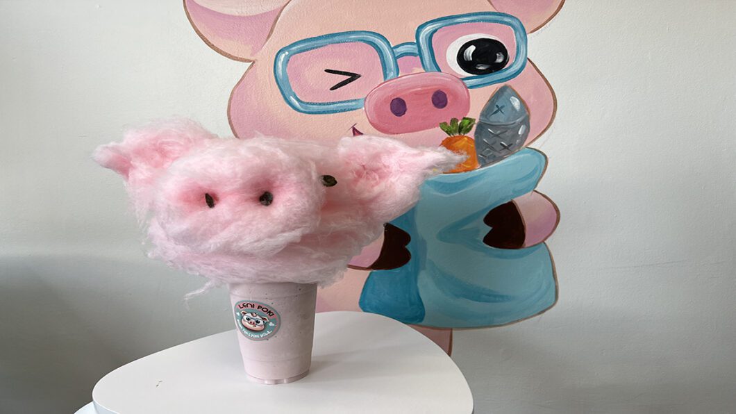 Milkshake with cotton candy head and art of pig. 
