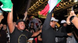 Event goers seen dancing around and waving Mexican flag