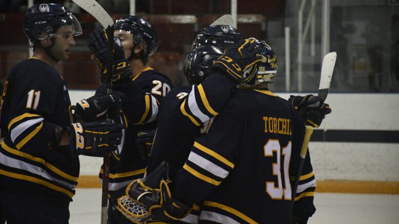 Nathan Torchia celebrates with his Windsor Lancers teammates after securing a 3-0 shutout victory over the University Toronto Varsity Blues, Saturday at Varsity Arena. (Photo: Ryan Galati)