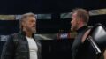 Adam Copeland (left) confronts a stunned Christian Cage (right) after the main event of AEW WrestleDream