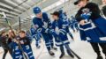 Leafs prospect Fraser Minten gifts a stick to a young fan at a team even. The 19-year-old has turned heads at his first pro training camp. (Courtesy Toronto Maple Leafs)