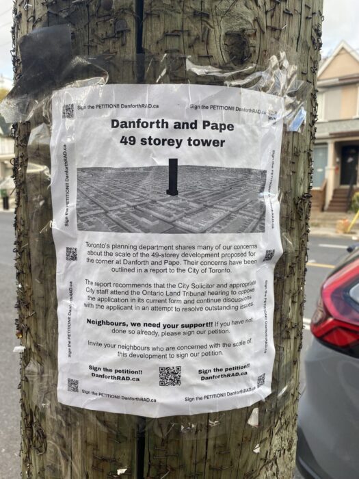 Danforth Residents For Appropriate Development's petition poster on a utility pole. 