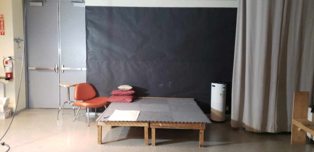 Room setup of where the live model will create different poses for attendees drawing the model for the sessions. 