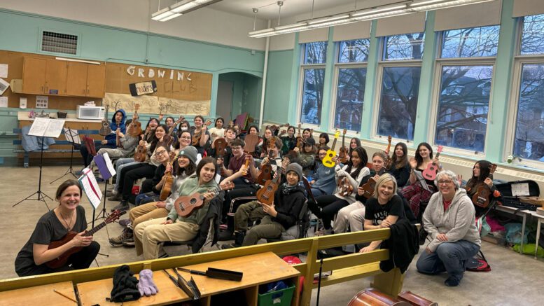 Melanie Doane (2nd from bottom right) with students of Doane Music School and 2 of her teachers in Toronto on Feb. 8, 2024. (Li Ho/The Toronto Observer)