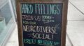 A sidewalk sign for Hard Feelings, Toronto boasts The Neurodiverse Social, Blue Sky Learning's free monthly social event for all.