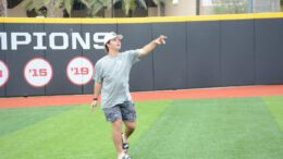 Carson Caso throwing a baseball