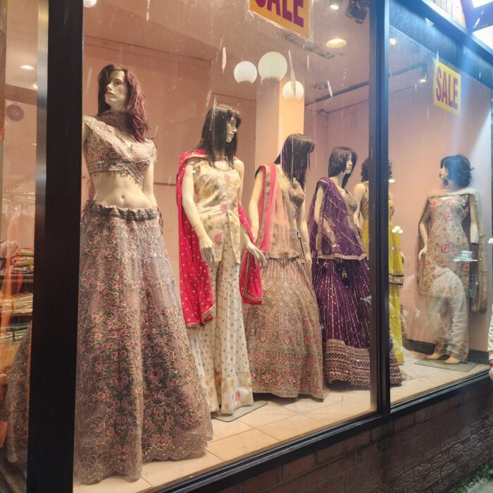 Vibrant Indian dresses on display for sale, lighting up Gerrard Street East on the eve of Eid.(Irtiza ali /Toronto Observer)
