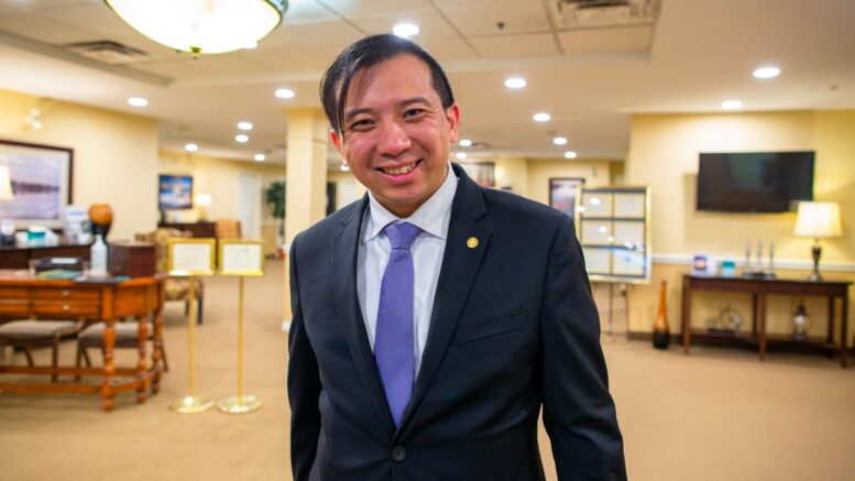 Philip Cheng, a funeral director at a funeral home in Markham, Ontario, in his uniform. He assists clients in planning funerals and handling anything death-related. (Photo courtesy Philip Cheng)

